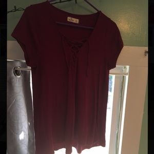 Dark maroon/plum Hollister shirt w/ cross strings